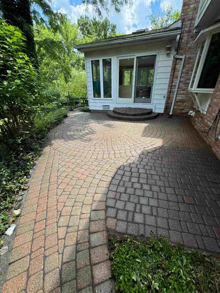 Brick paver patio surface before cleaning and sealing
