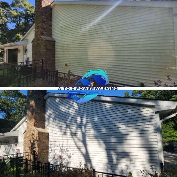 Before and after house wash on vinyl siding beside a stone chimney